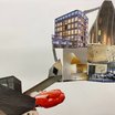 Collage aus ausgeschnittenen Fotografien moderner Architektur, Innenräume und eines roten Sportwagens auf weißem Hintergrund.